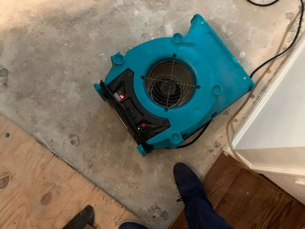 Air mover drying subfloor during Leak Detection & Repair in Toronto